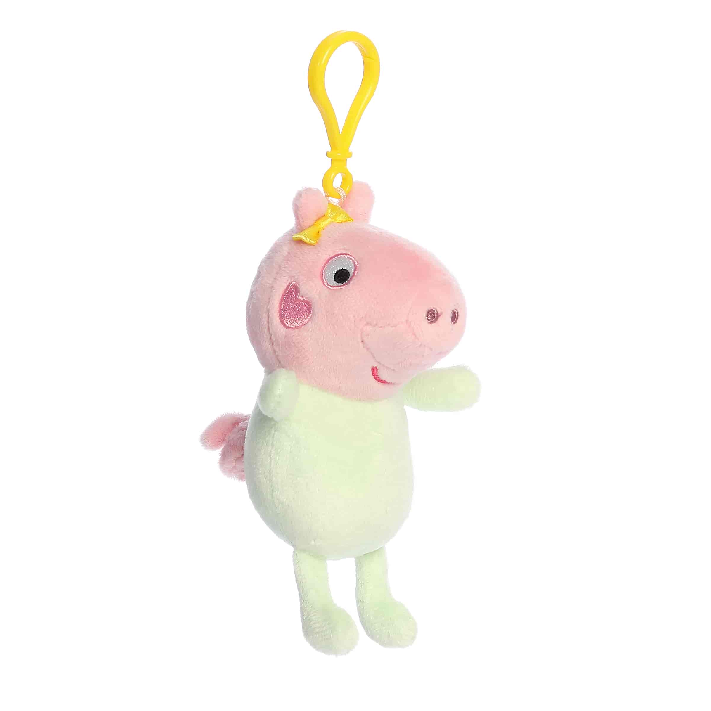 A Baby Evie clip-on plush wearing a green outfit with a yellow clip from Aurora’s Peppa Pig Collection.
