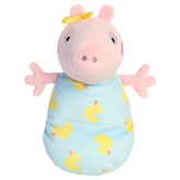 A Baby Evie plush toy from Aurora wrapped in a blue swaddle with rubber ducky details and a yellow bow.
