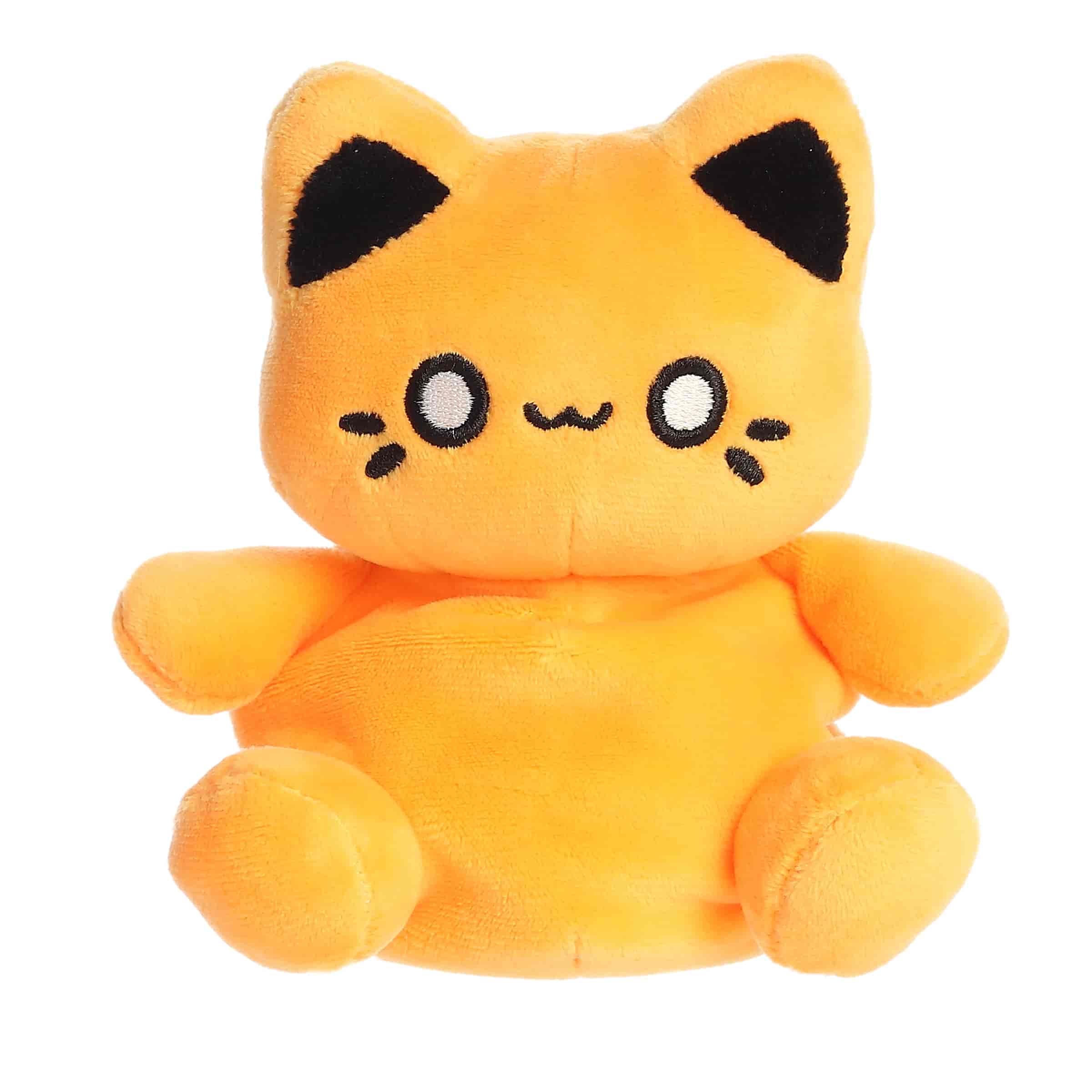 A bright orange Meowchi kitty plush with a cheerful smile from the Tasty Peach Palm Pals Collection.