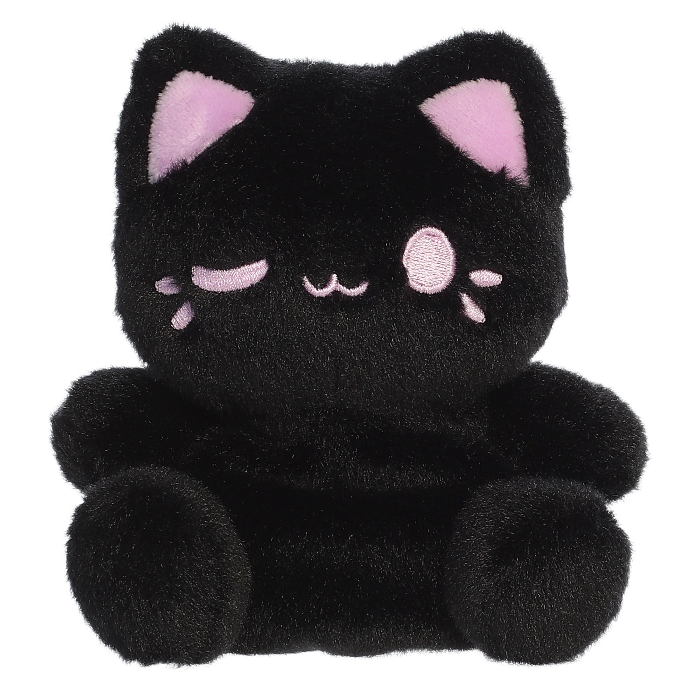 A black cat plush toy from Aurora with rounded paws, taro purple inner ears, and a matching winking expression.