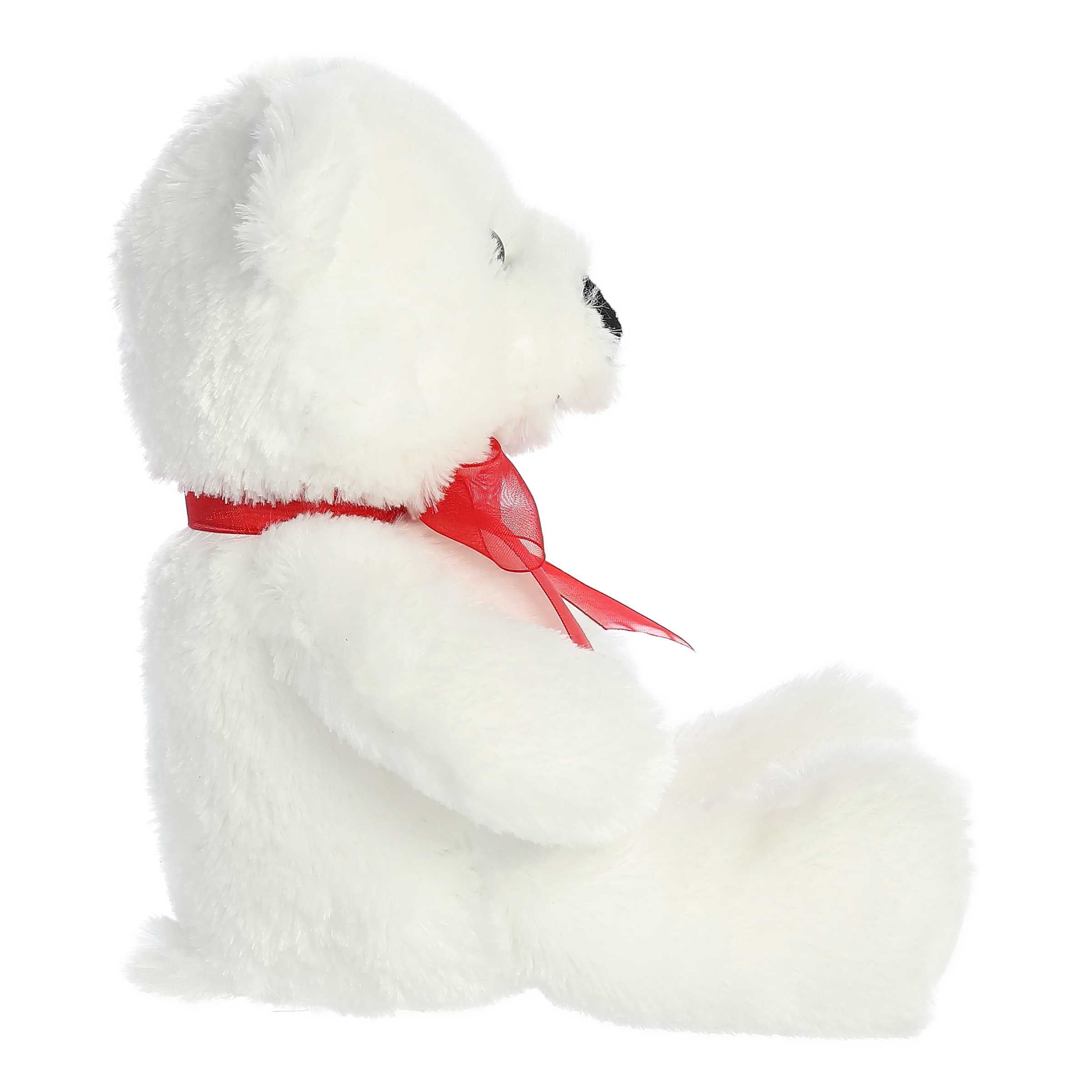 Aurora's White Bear plush, with luxurious white fur and vibrant red bow, ideal for gifts and decor.