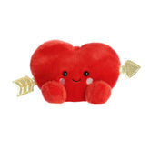 A red heart-shaped plush with golden arrows and rosy cheeks from the Palm Pals Valentine's Collection
