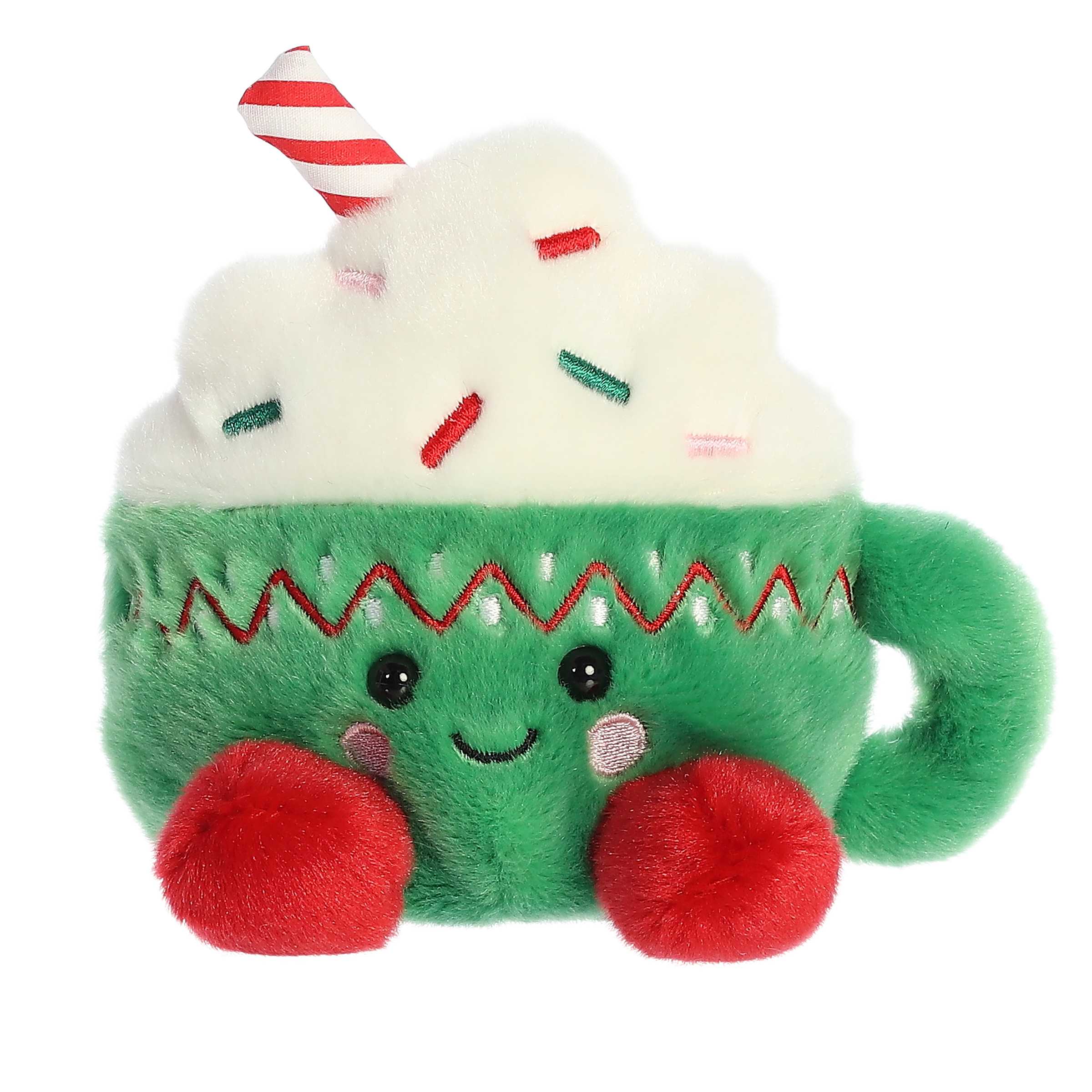 Candace Hot Cocoa Palm Pal plush, green cup with whipped cream, ideal for cozy holiday decor and comfort.