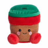 Holiday cup plush with brown sleeve, red accents, green lid, blushing cheeks, and warm smile