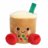 Light brown boba plush with red and green pearls, cream topping, green straw, rosy cheeks, and a smile