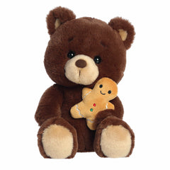 Brown bear plush holding a gingerbread cookie, with rich texture and a cheerful face