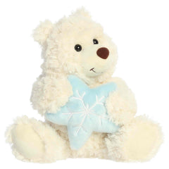 White teddy bear plush holding a soft blue snowflake