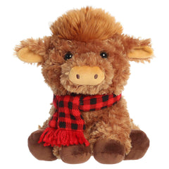 Shaggy brown highland cow plush wearing a red plaid scarf