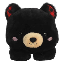 Black bear plush with plaid ear details and a relaxed belly-down pose
