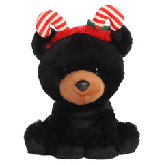 Shaggy brown highland cow plush wearing star-topped holiday antlers