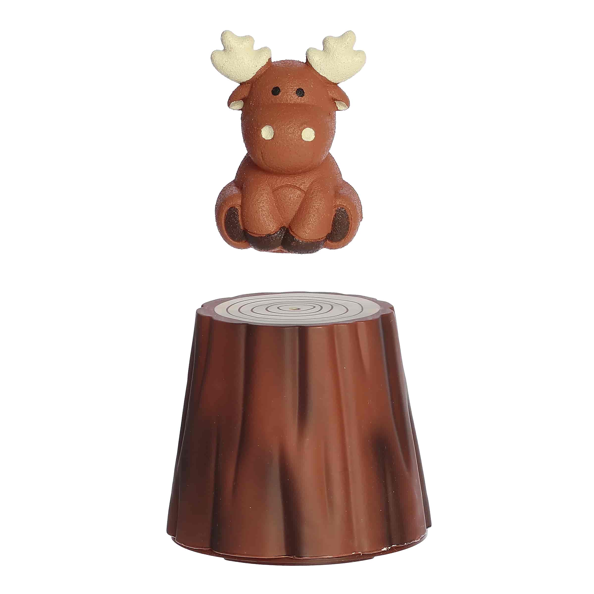 A Grow Moose toy by Aurora Toys featuring a moose figure hidden in a tree trunk that expands in water