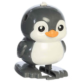 Penguin Wind & Pop Egg toy with white shell, walking penguin, and colorful box.