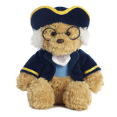 Plush Ben Franklin Bear in blue coat and glasses from Aurora, ideal for educational play and cuddly storytimes.