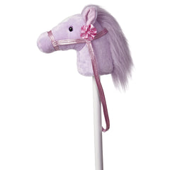 A lavender fantasy pony hobby horse plush toy from Giddy-Up Friends with a pink ribbon and sparkly bridle.