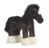 A black and white horse plush toy from Aurora with a detailed mane, tail, and stitched saddle pattern.