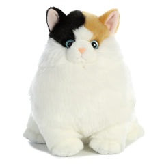 Plush toy of a calico cat with white, orange, and black fur and bright blue eyes.