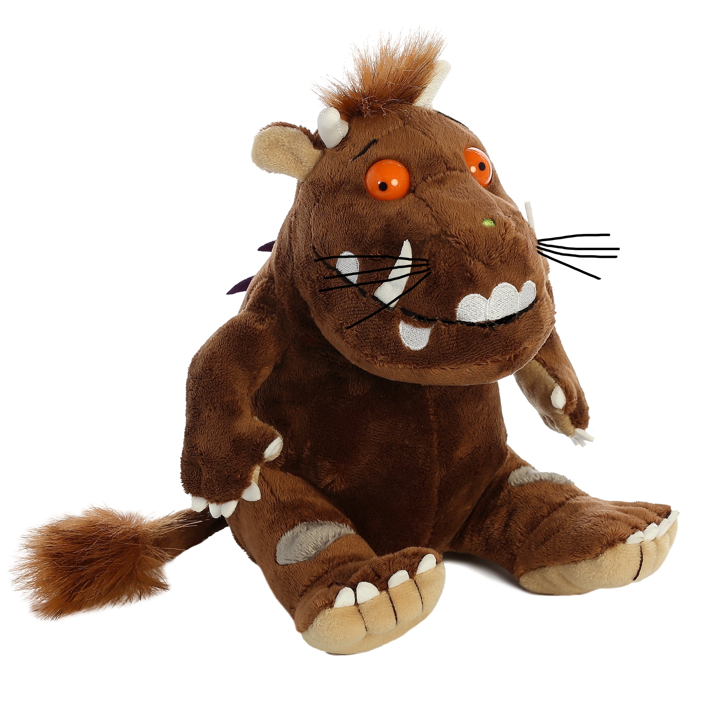 A brown plush toy from Aurora with orange eyes, tusks, and spiky fur, inspired by the Gruffalo character.