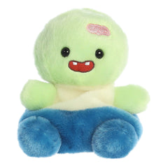 Spooky green zombie stuffed animal sitting with blue pants and embroidered brains opening on head