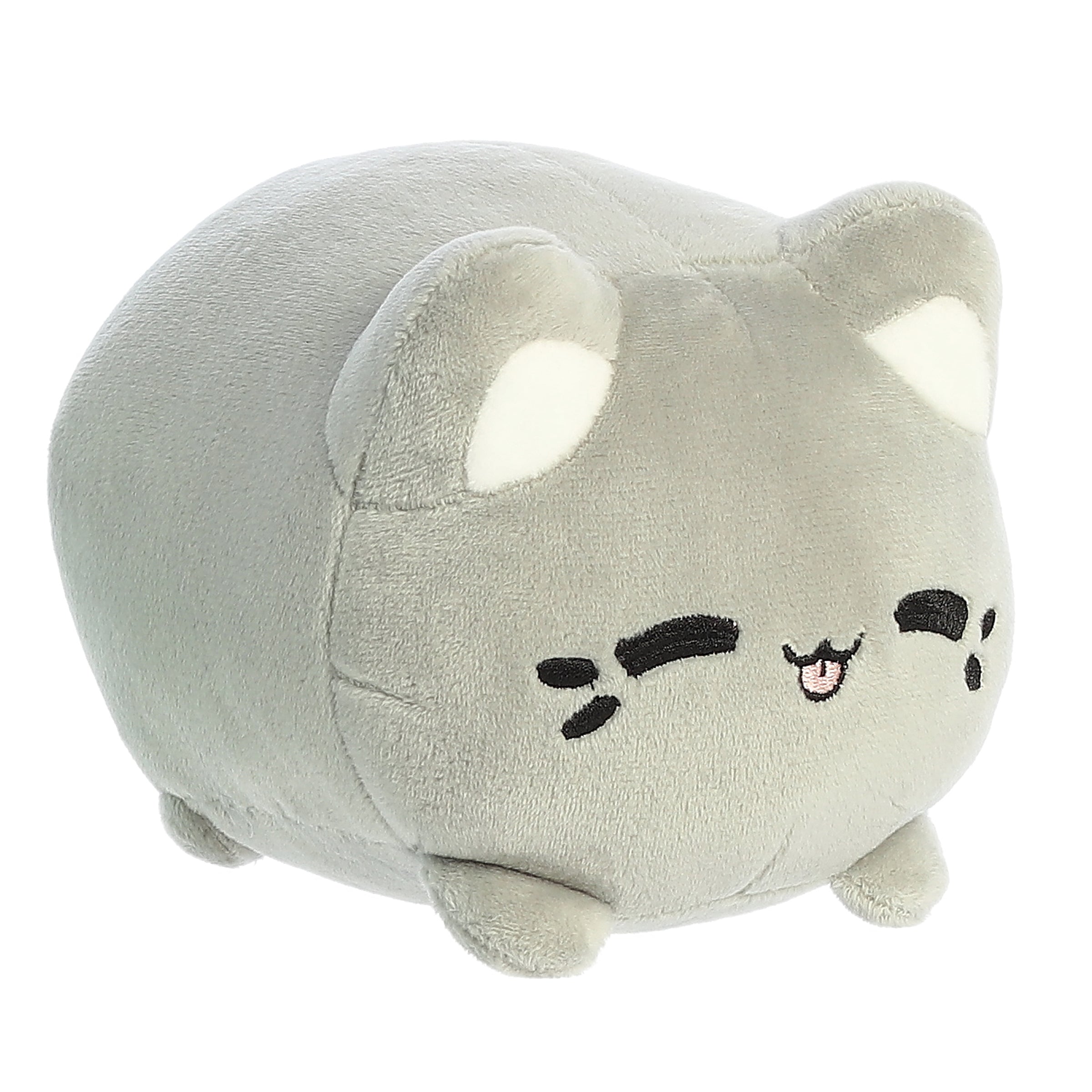 A gray Tasty Peach Meowchi plush that is a round cylinder shape with the resemblance of an animated squinting happy cat.