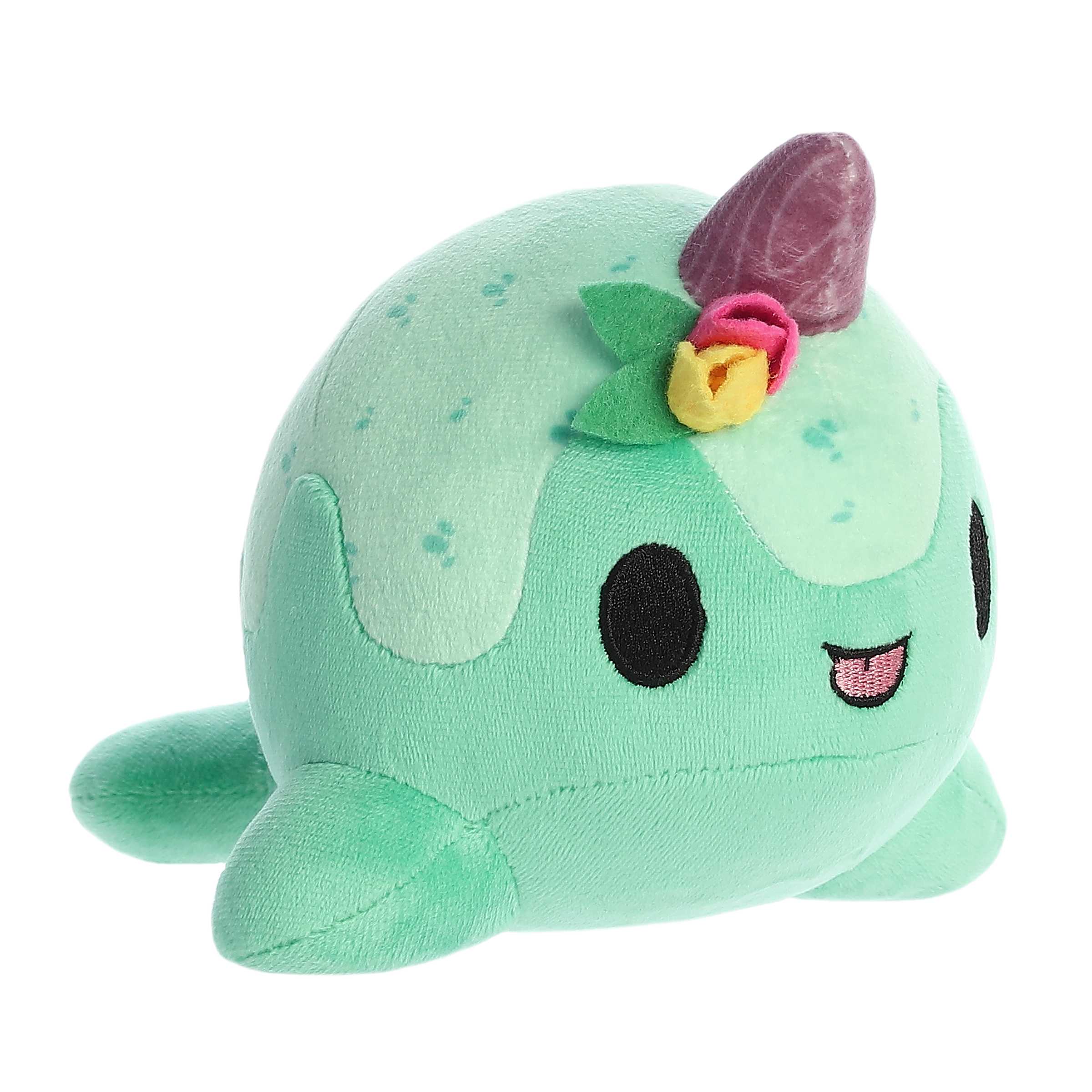 Tulip Nomwhal plush in minty green, adorned with a colorful tulip and sparkling horn, perfect for gifting and collecting.