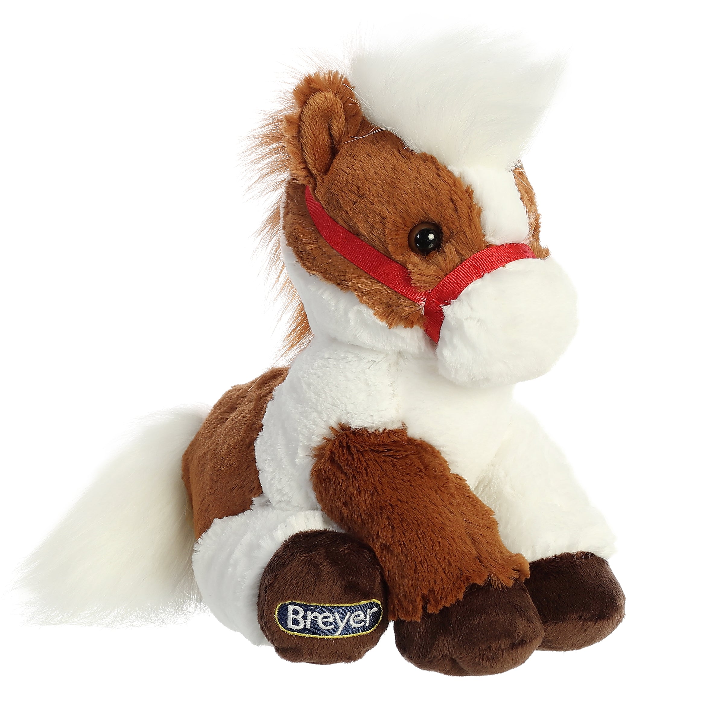 Pinto Horse plush from Breyer - Bridle Buddies by Aurora, with brown and white patches and a bright red bridle.