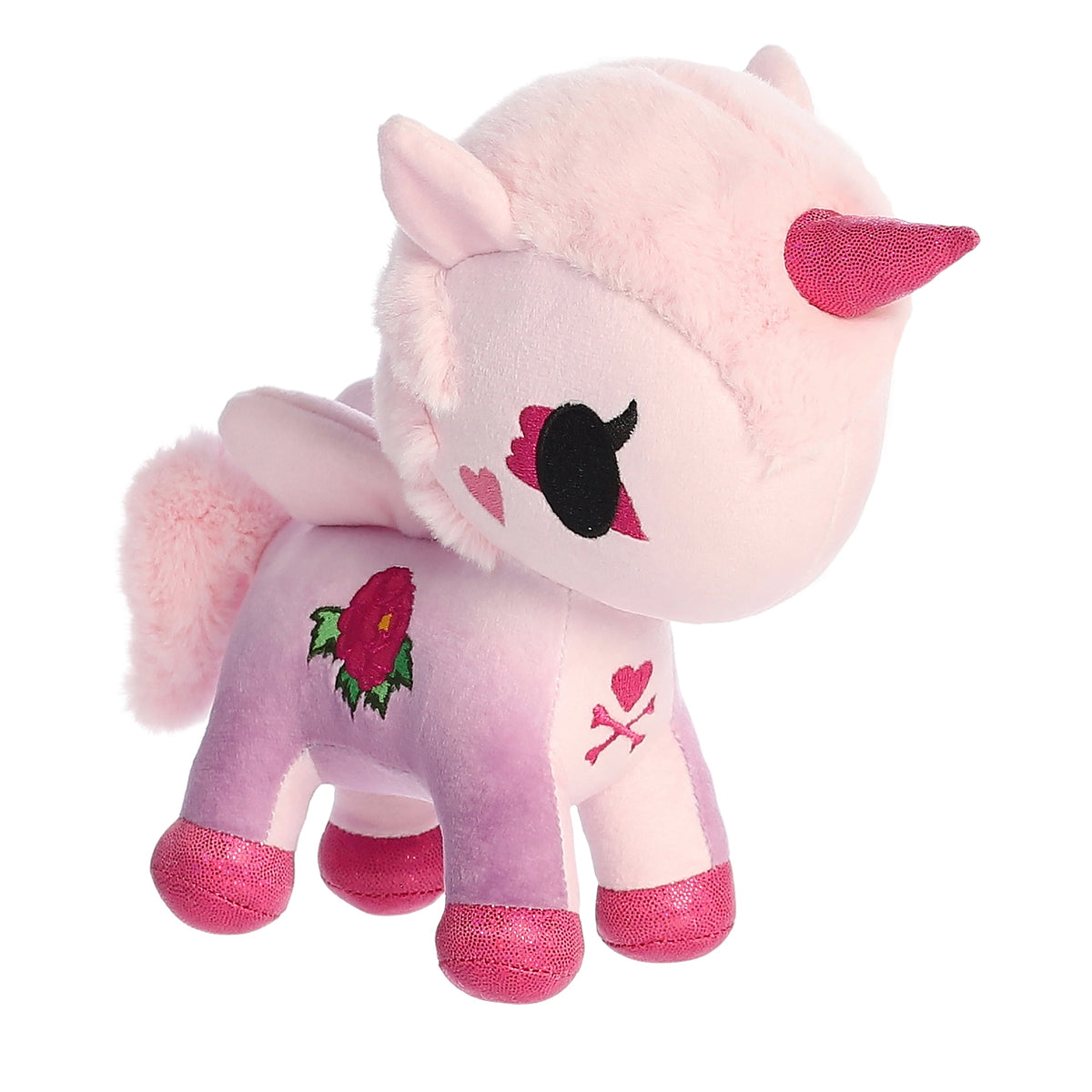 A unicorn with a pink body and hot-pink hooves and horn while sporting an embroidered peony on its side.