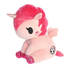 Cute colorful unicorn plush in a sitting position with pink body and bright pink fur, sparkly hooves and detailed embroidery.