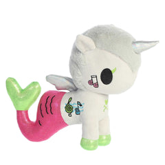 tokidoki Deejay Mermicorno plush with purple-green tail, grey body, silver horn, and wings, bringing a melody of magic.