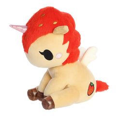 Aurora's Delicious Unicorno plush with a tan body, pink glittery horn, and strawberry embroidery brings sweetness to playtime