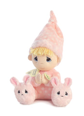 A plush doll from Precious Moments in a pink polka-dot nightgown with bunny slippers and blonde yarn hair.