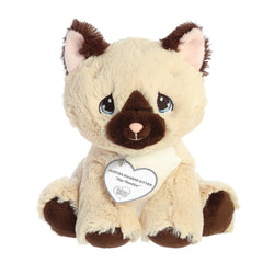 A seated tan and brown kitten plush with tear-drop eyes and a precious moments inspirational tag around its neck.