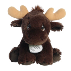 A seated brown moose plush with tear-drop eyes, tan antlers, and a precious moments inspirational tag around its neck.