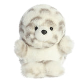 A Seal plush with white and gray spots, balancing adorably, ready for cuddles with an extra-fluffy head and charming pose.