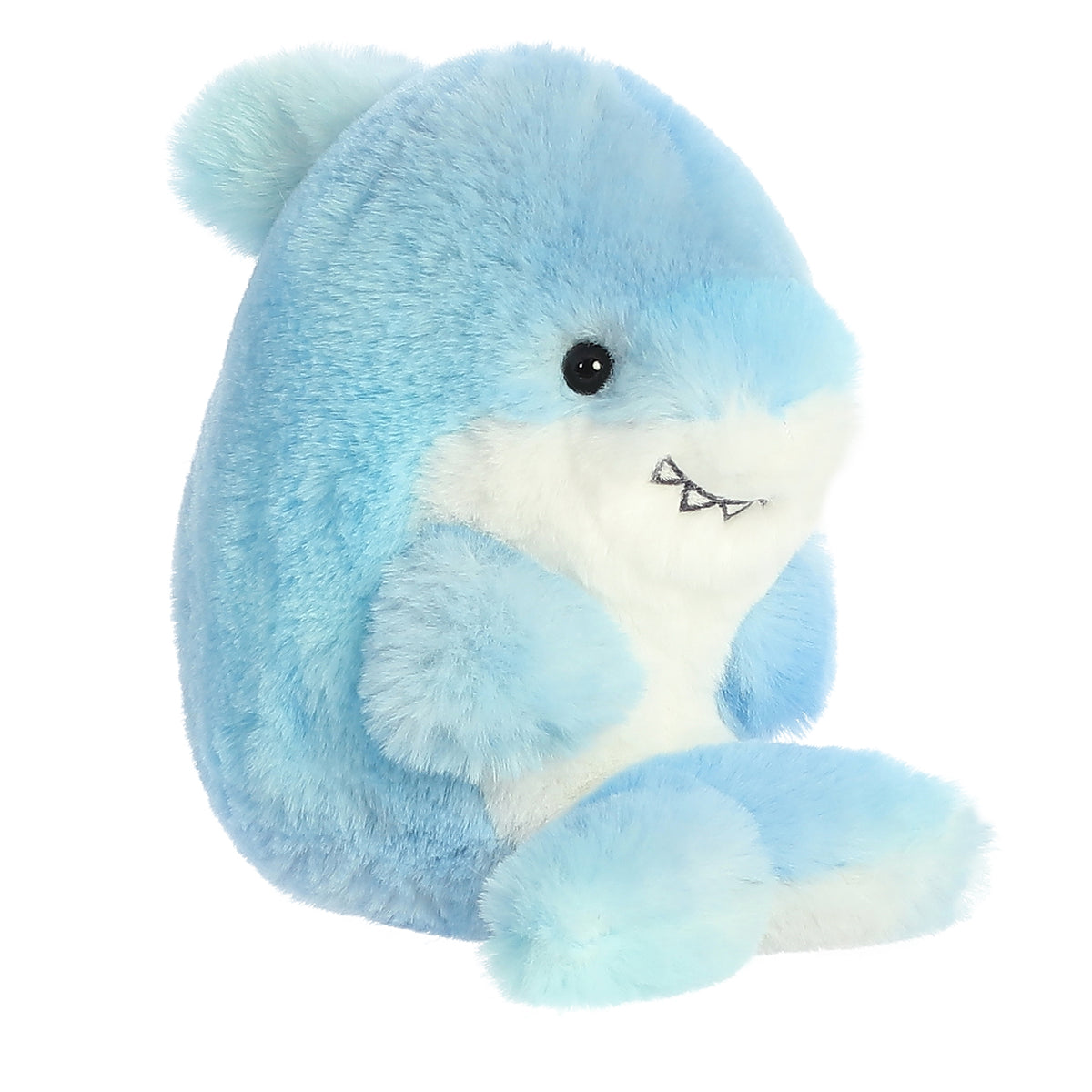 Shark plush, baby blue with a white belly, exudes playfulness with a wide, infectious smile, arms tucked and legs aimed up!