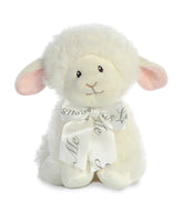 Soft plush Blessings Lamb by ebba with pink ears and a 'Jesus Loves Me' ribbon, ideal for comfort and nursery decor.