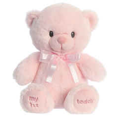 A pink teddy bear plush toy from ebba baby toys with a satin bow and embroidered eyes.