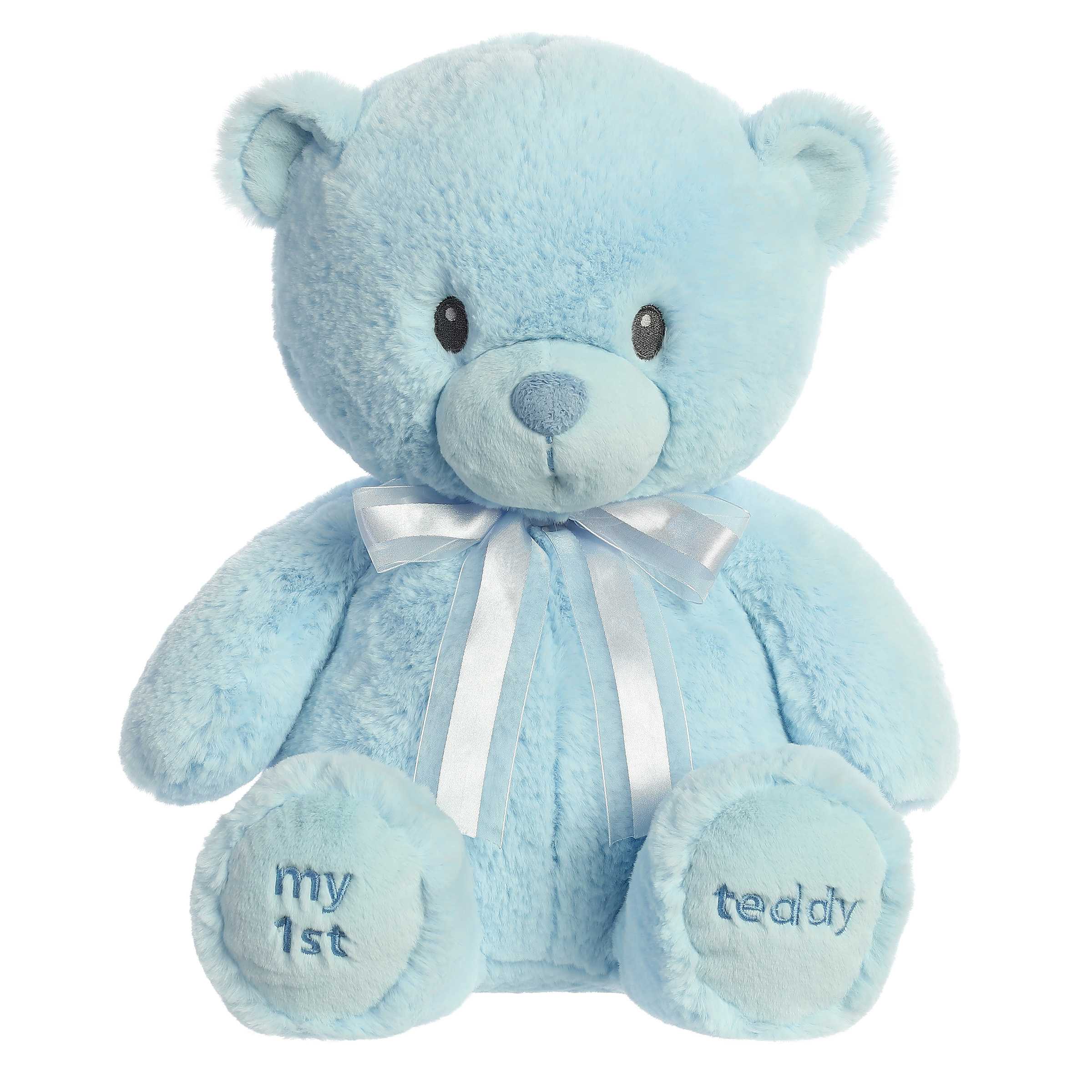 A blue teddy bear plush toy from ebba with embroidered eyes and a matching satin bow.
