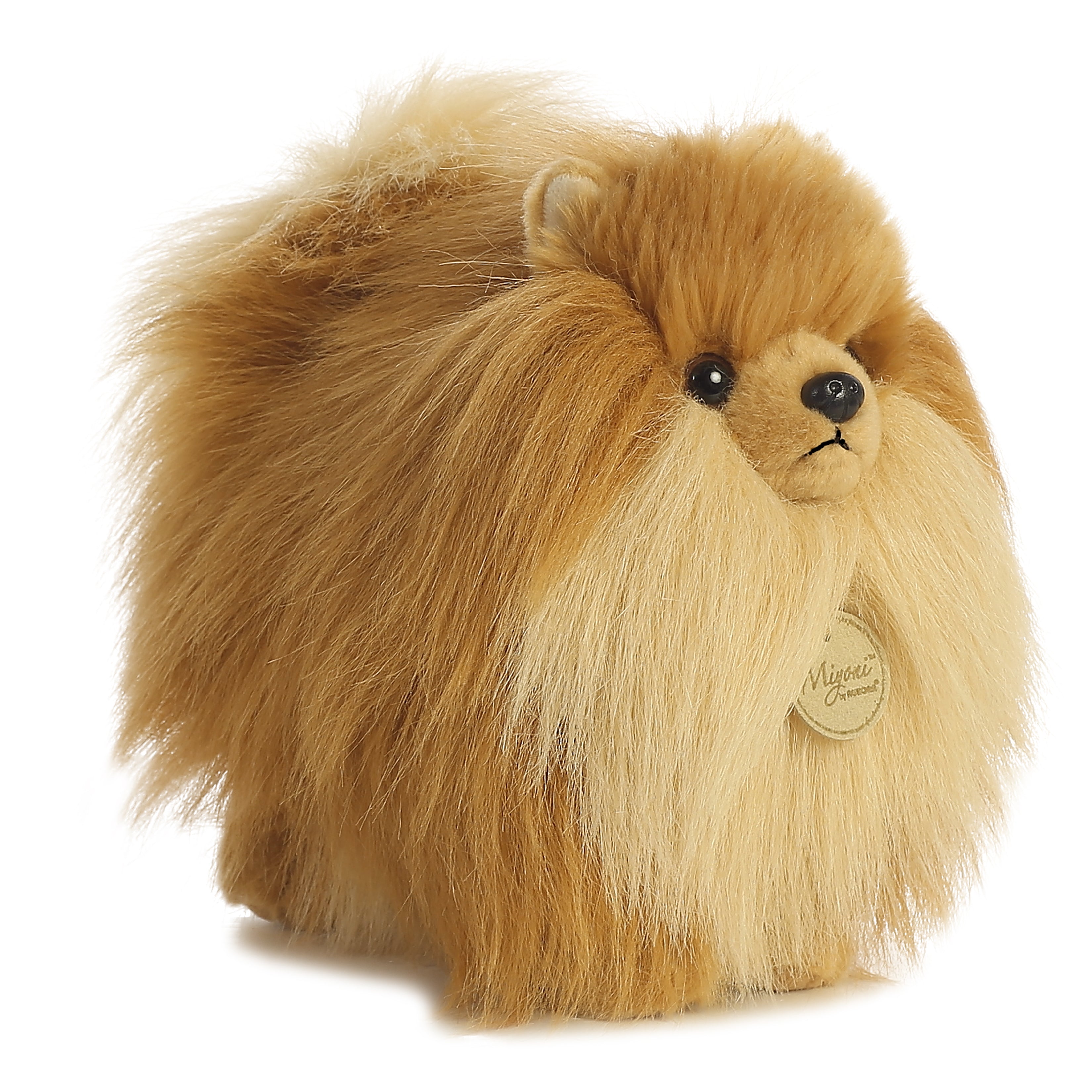A golden Pomeranian dog plush toy from Miyoni by Aurora with fluffy fur and a cheerful expression.