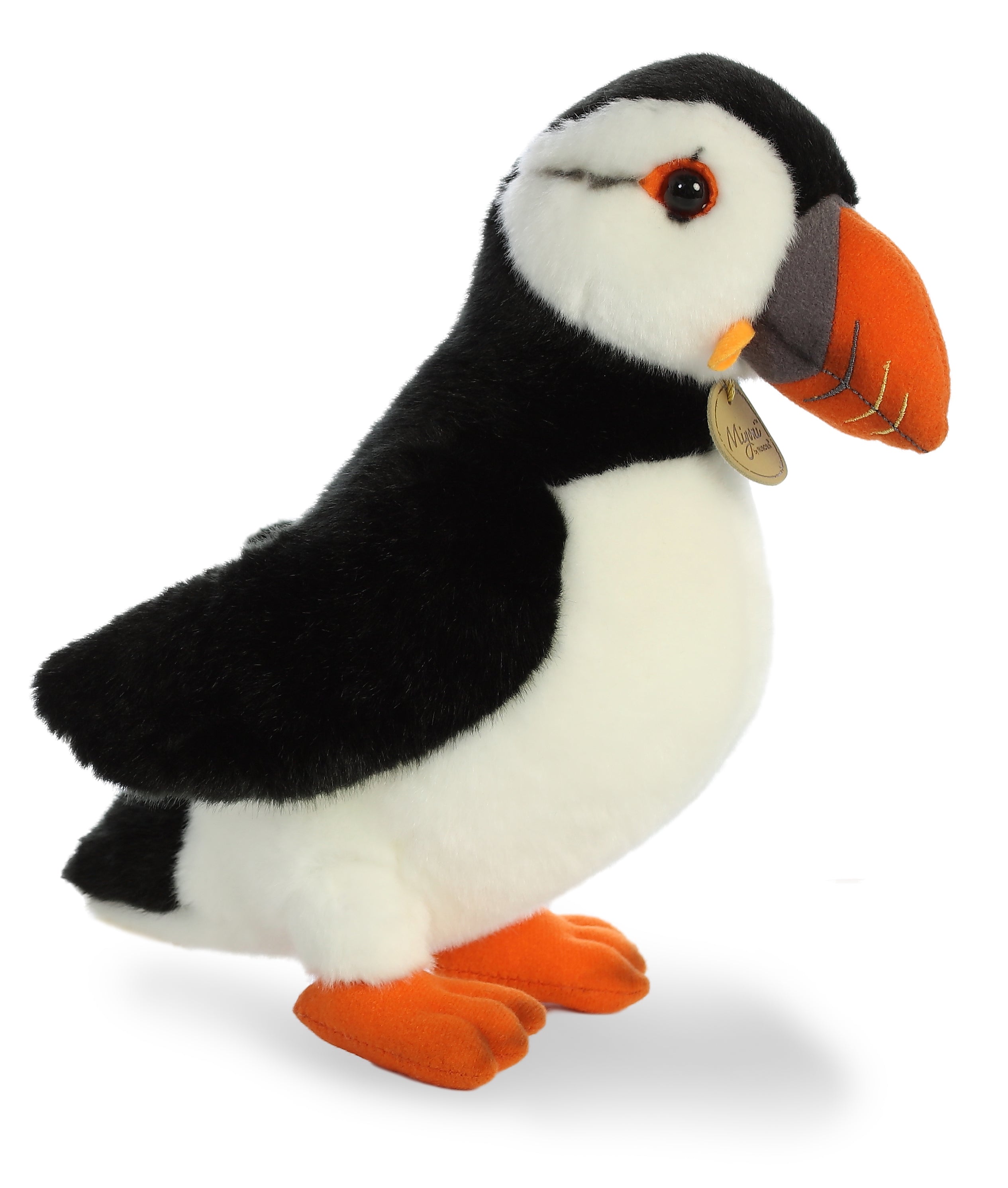 A puffin plush toy from Miyoni by Aurora with black and white feathers and a bright orange beak.