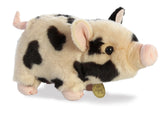 A spotted pot-bellied piglet plush toy from Miyoni Tots by Aurora with cream fur and black markings