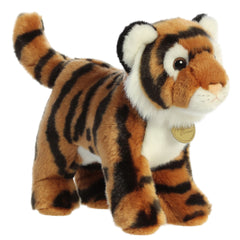 An orange Bengal tiger plush toy from Miyoni by Aurora with black stripes and a white underbelly.