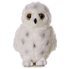 Plush toy of a snowy owl with white plush fur, grey spots, and large round eyes by Aurora plush.