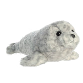 A gray harbor seal plush from Mini Flopsie by Aurora with speckled fur and an endearing face.