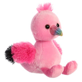 A pink flamingo plush from Mini Flopsie by Aurora with a rainbow beak and black-tipped wings.