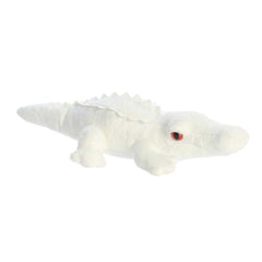 Distinctive albino alligator plush with white color, red eyes, and textured scales, capturing its unique charm, by Aurora.