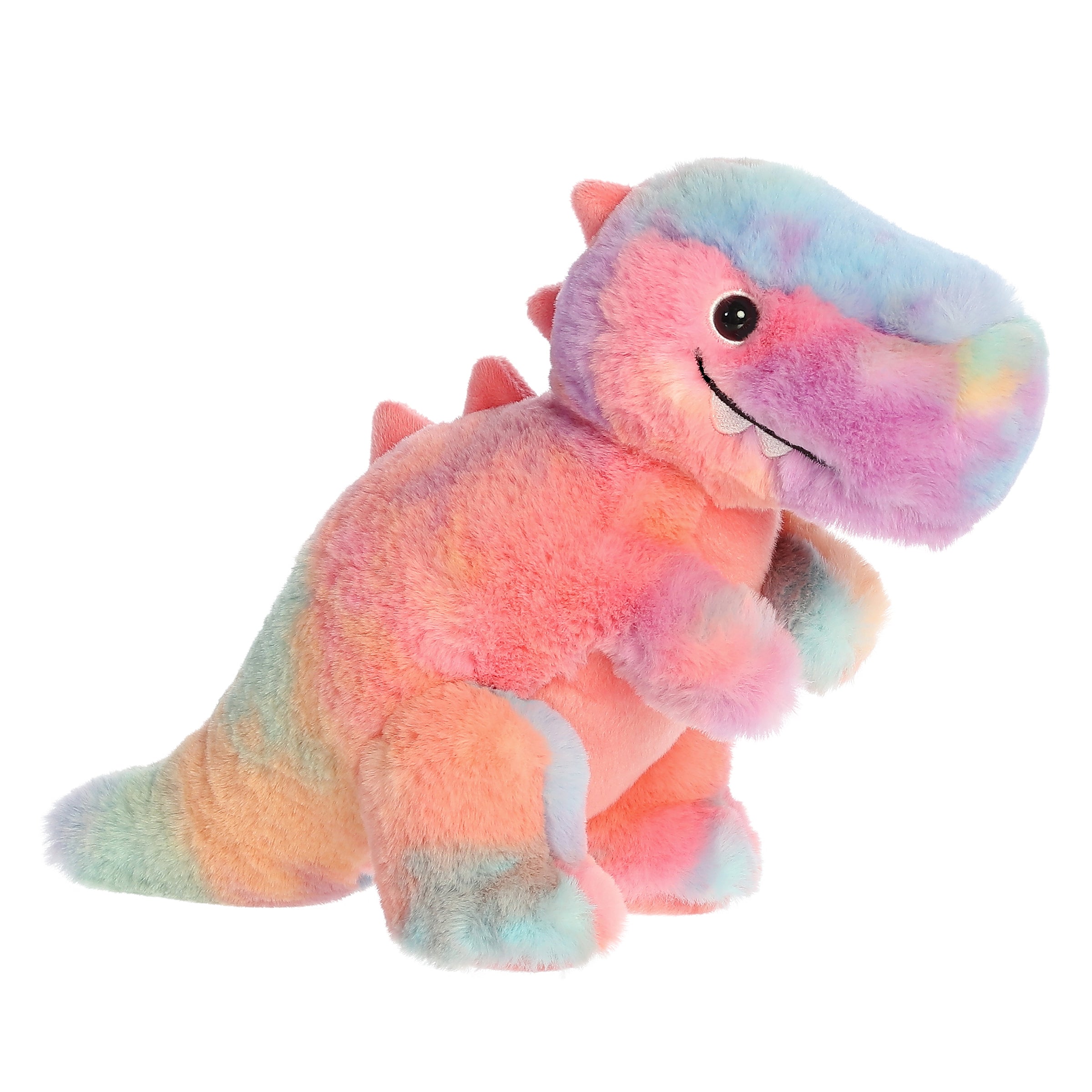 A multicolored T-Rex dino plush, adorned in a dynamic watercolor rainbow pattern and an adorable grin with two teeth out