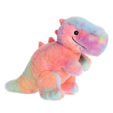 A multicolored T-Rex dino plush, adorned in a dynamic watercolor rainbow pattern and an adorable grin with two teeth out