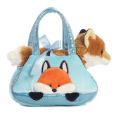 Peek-A-Boo Fox plush from Fancy Pals by Aurora, nestled in a shimmering ice blue carrier with a satin bow