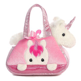 Peek-A-Boo Unicorn plush from Fancy Pals by Aurora, peering from a pink carrier with silver horn and bow