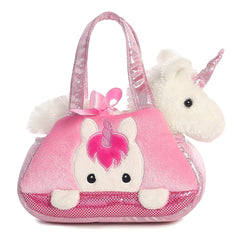 Peek-A-Boo Unicorn plush from Fancy Pals by Aurora, peering from a pink carrier with silver horn and bow